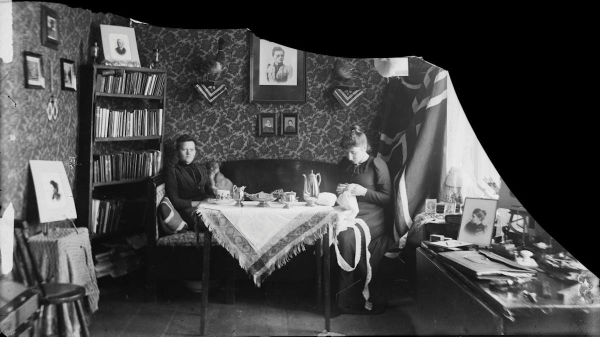 Two women in their home together