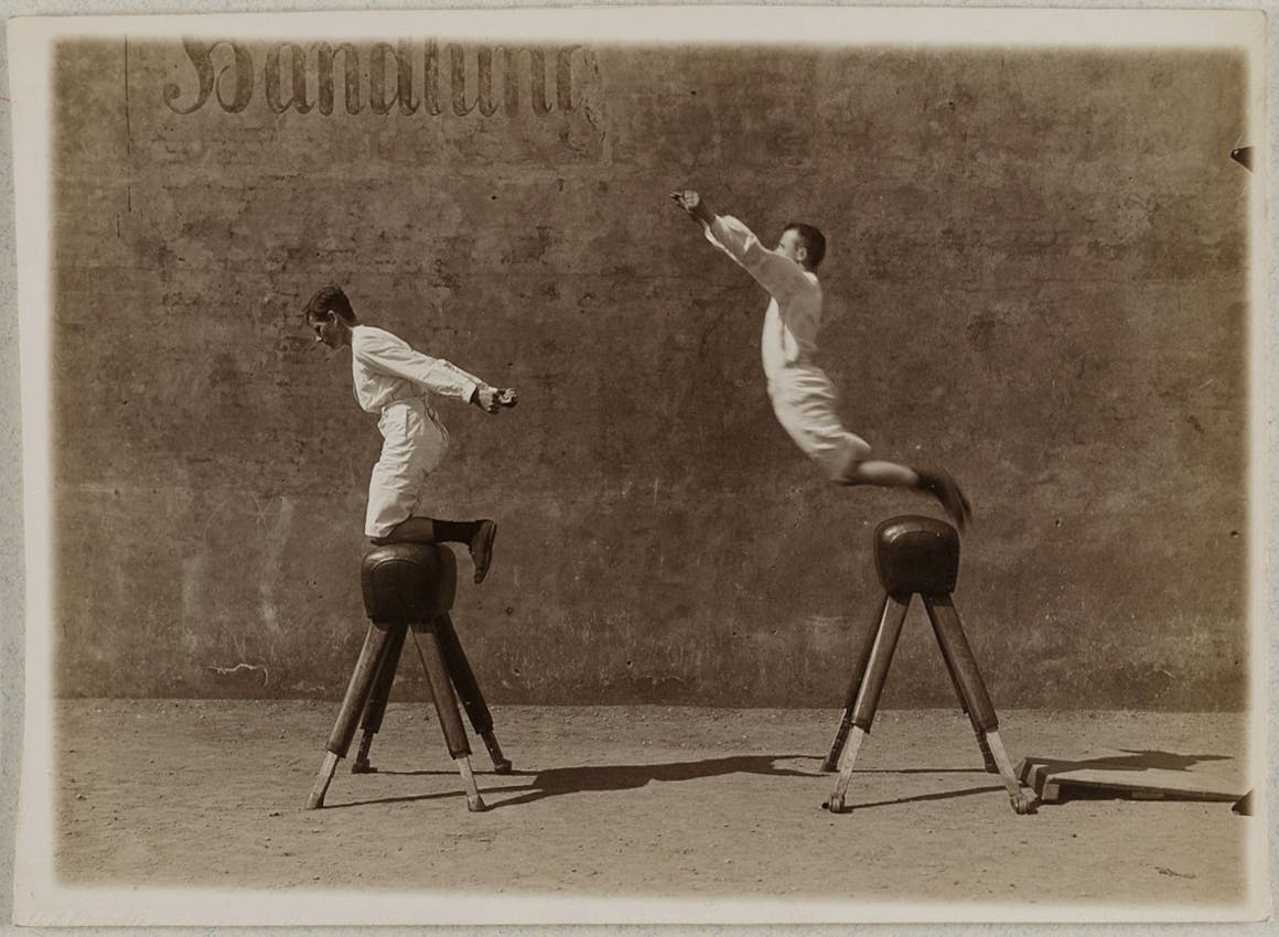 photograph of child on monkey bars