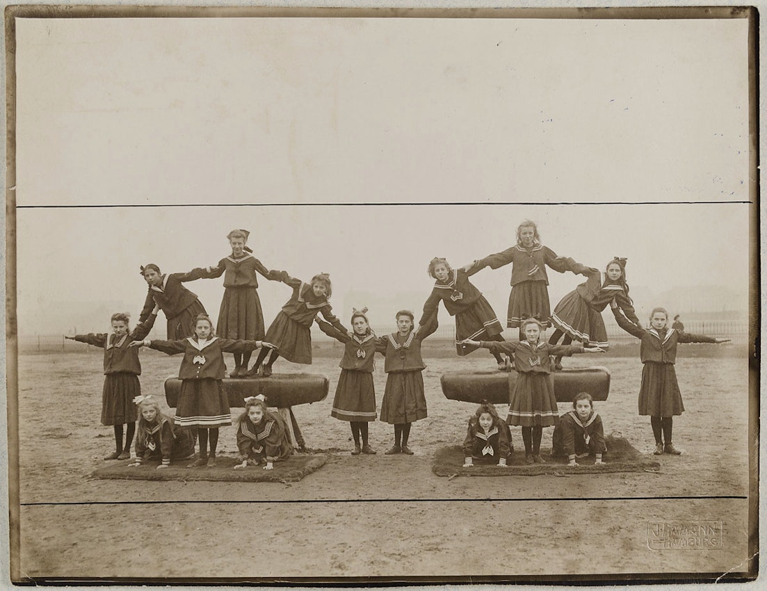 photograph of girls forming a pyramid
