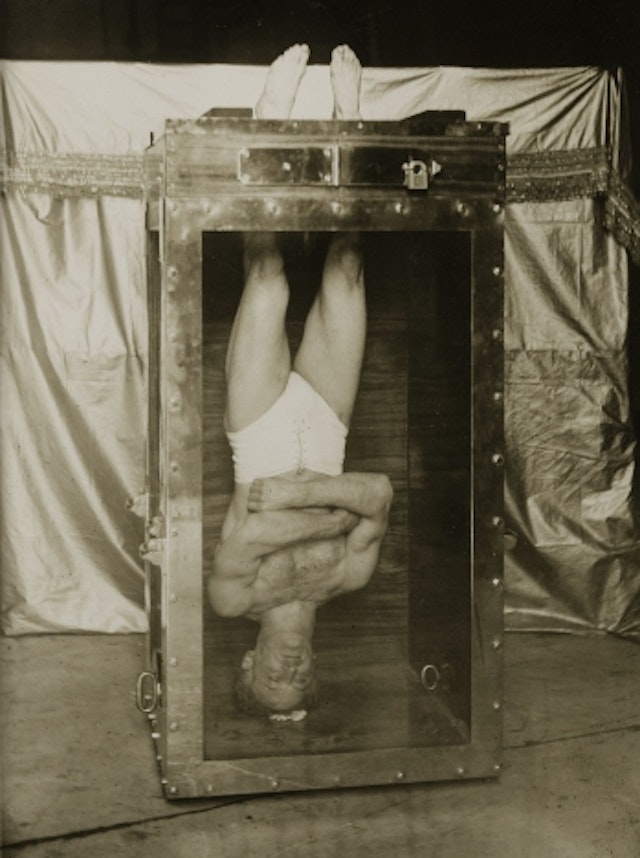 Houdini on his Water Torture Cell (1914)