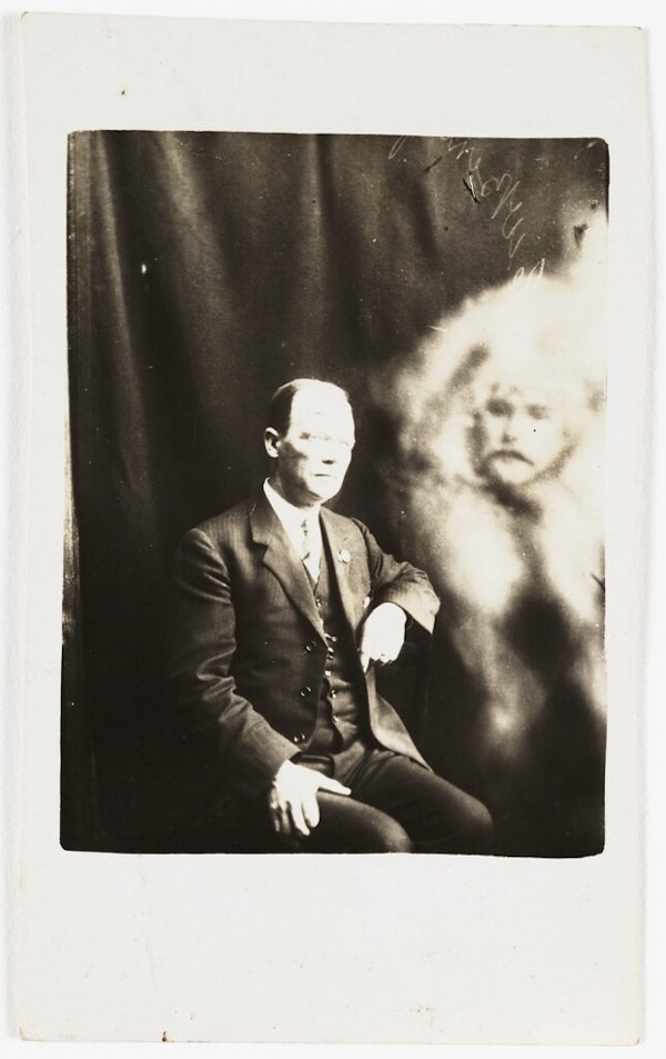 Man with a spirit face appearing