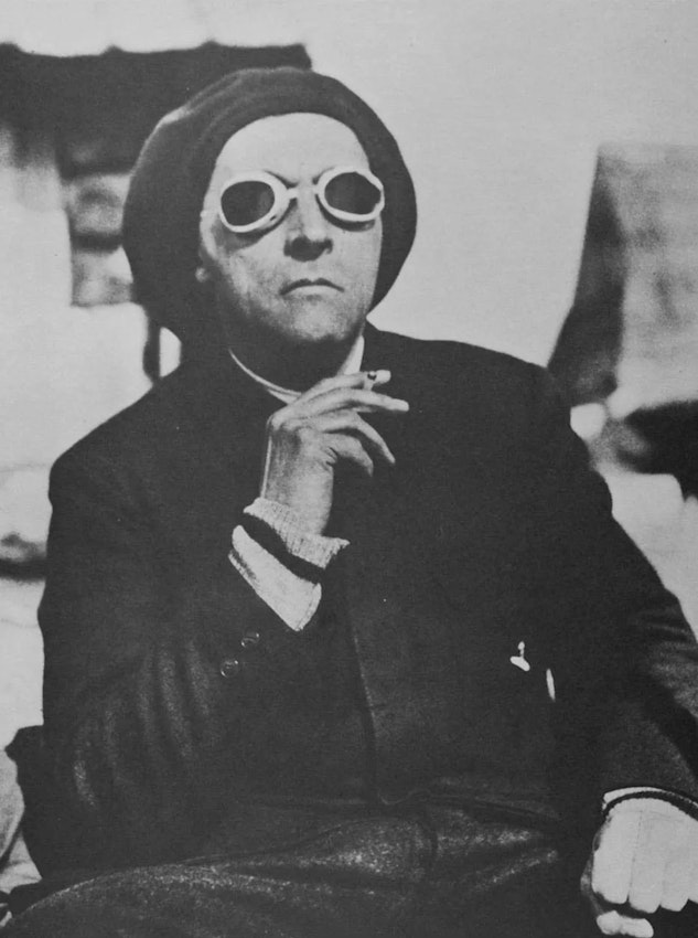 Witkiewicz wears dark goggles and a beret