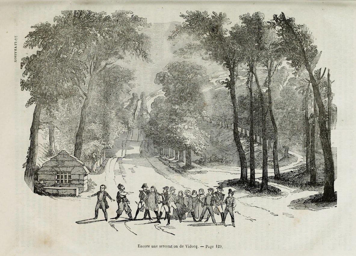 Black and white etching titled ‘Encore une arrestation de Vidocq,’ showing a group of men escorting a handcuffed individual down a tree-lined country road, with a small hut on the left and the road winding into the distance surrounded by dense foliage.