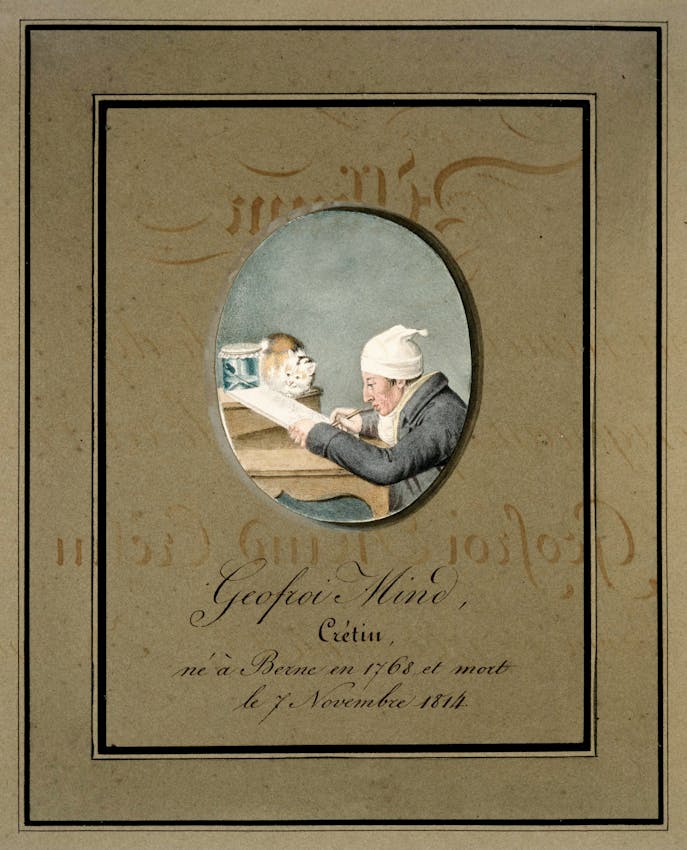 A man in a white cap focuses on drawing at his desk, with a cat resting nearby, watching him closely. The scene is framed in an oval, surrounded by calligraphic text that identifies the artist as ‘Geofroi Mind.’