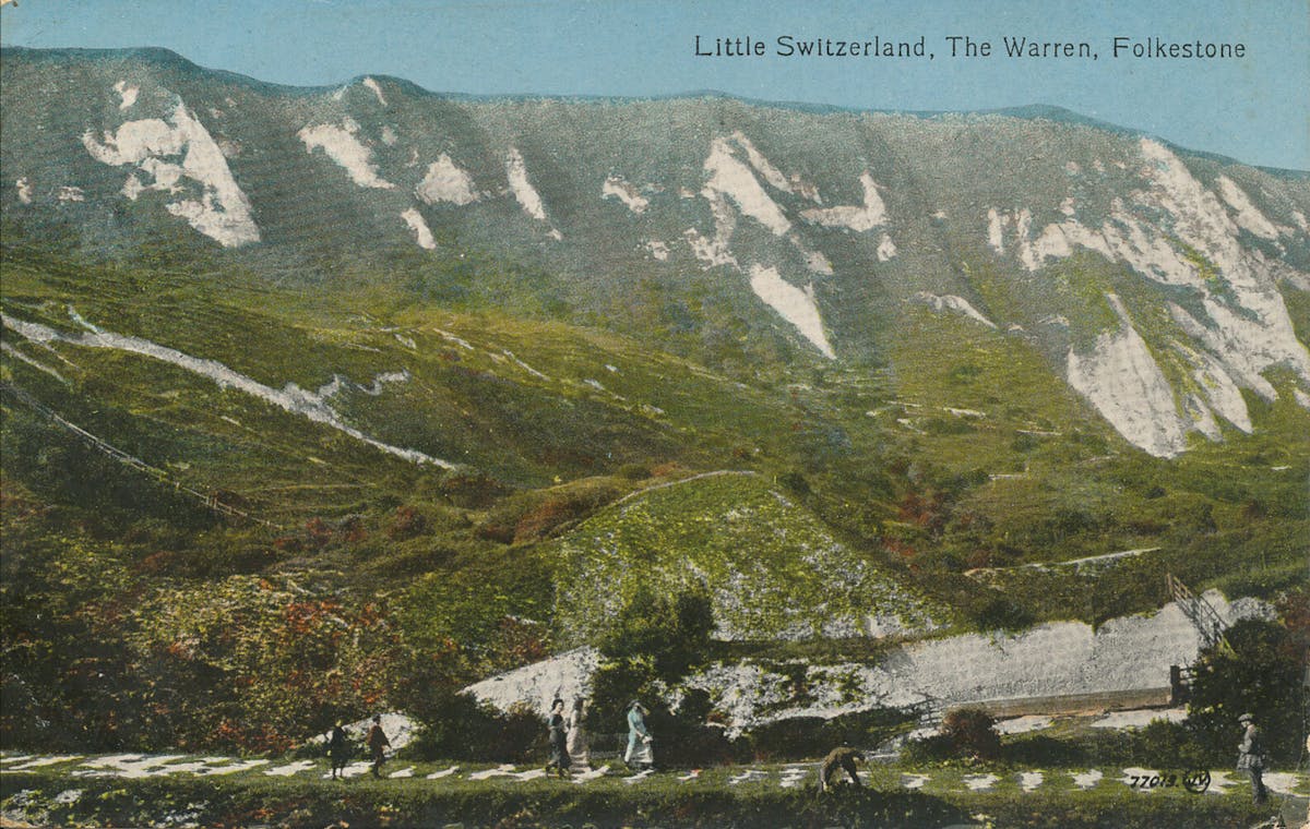 Walkers in the foreground with mountains in the background