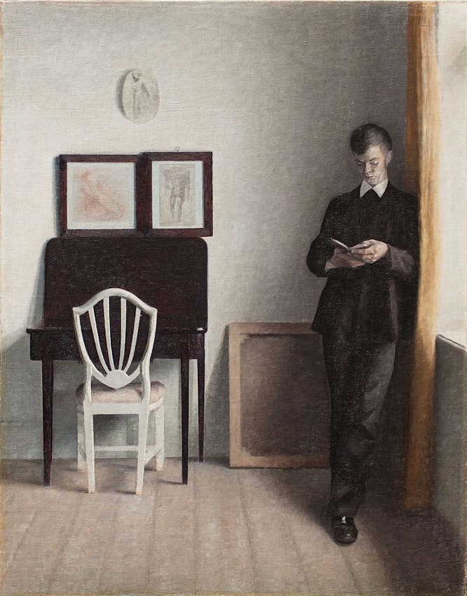 Vilhelm Hammershøi Interior with a Young Man Reading