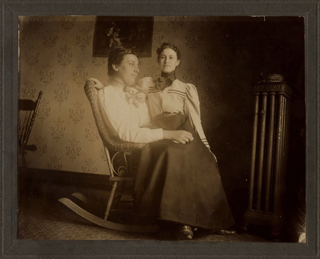 two women on a rocking chair