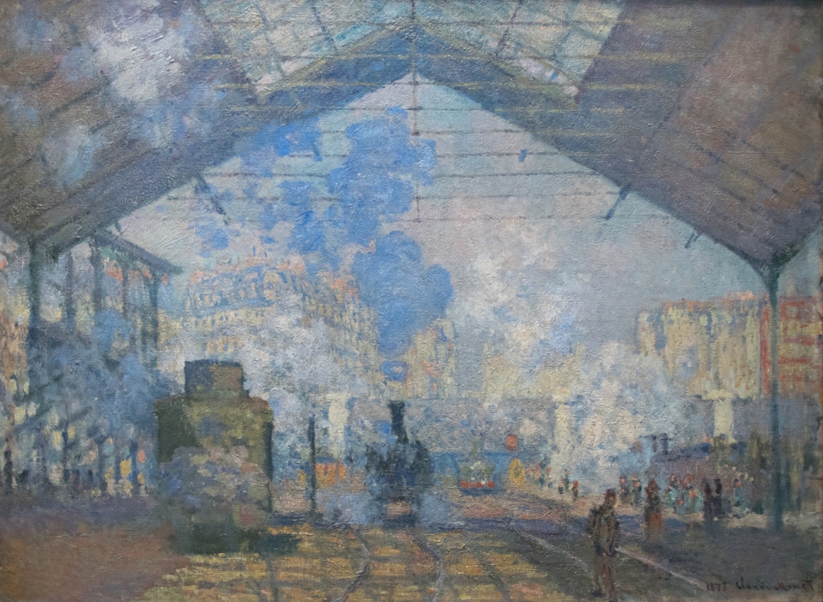 La Gare Saint Lazare Claude Monet)
caption={Claude Monet, *La Gare Saint-Lazare*, 1877 — <a href="https://commons.wikimedia.org/wiki/File:La_Gare_Saint-Lazare_-_Claude_Monet.jpg" rel="noopener noreferrer" target="_blank">Source</a>