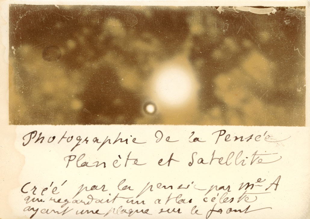 A poorly exposed photograph with splotches that might resemble planets
