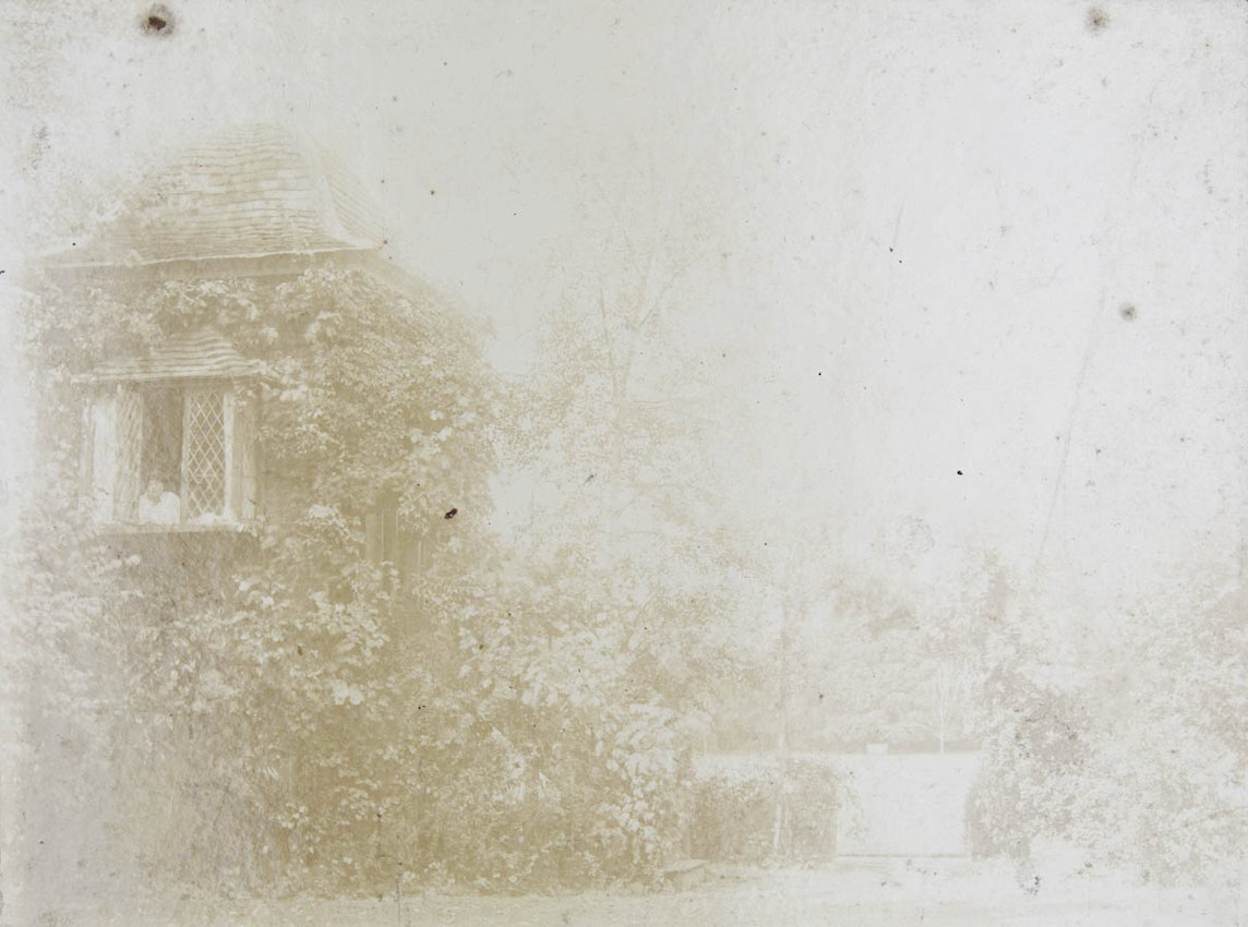 Photograph of Marie Corelli leaning out of a window in Stratford-upon-Avon