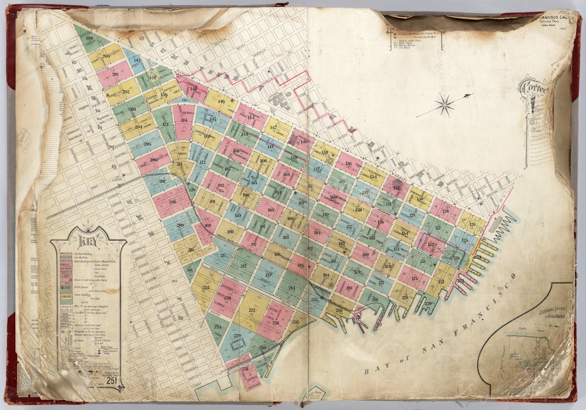 A detailed map depicting numbered and color-coded plots of land in a grid layout along the waterfront of San Francisco, with a key explaining the different colors and symbols used.