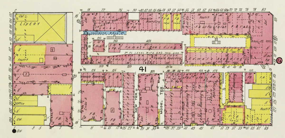 This map illustrates a layout of buildings with specific designations like female boarding, restaurants, and offices. It includes labels for structures such as livery, concrete walks, and multiple boarding facilities, each marked with measurements and additional notations.