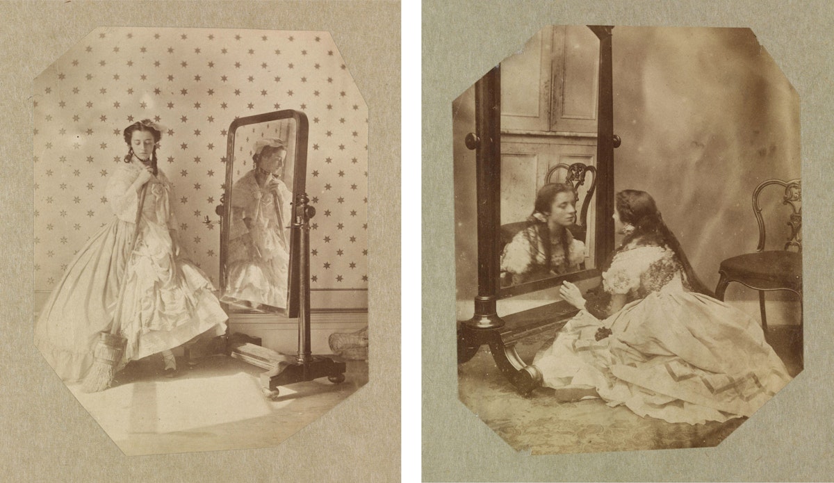 Two sepia-toned photographs side by side. On the left, a woman in a mid-19th century dress is standing and adjusting a necklace, her reflection visible in a tall mirror beside her. On the right, a woman is seated on the floor, leaning forward to look into a mirror, engaging with her own reflection.