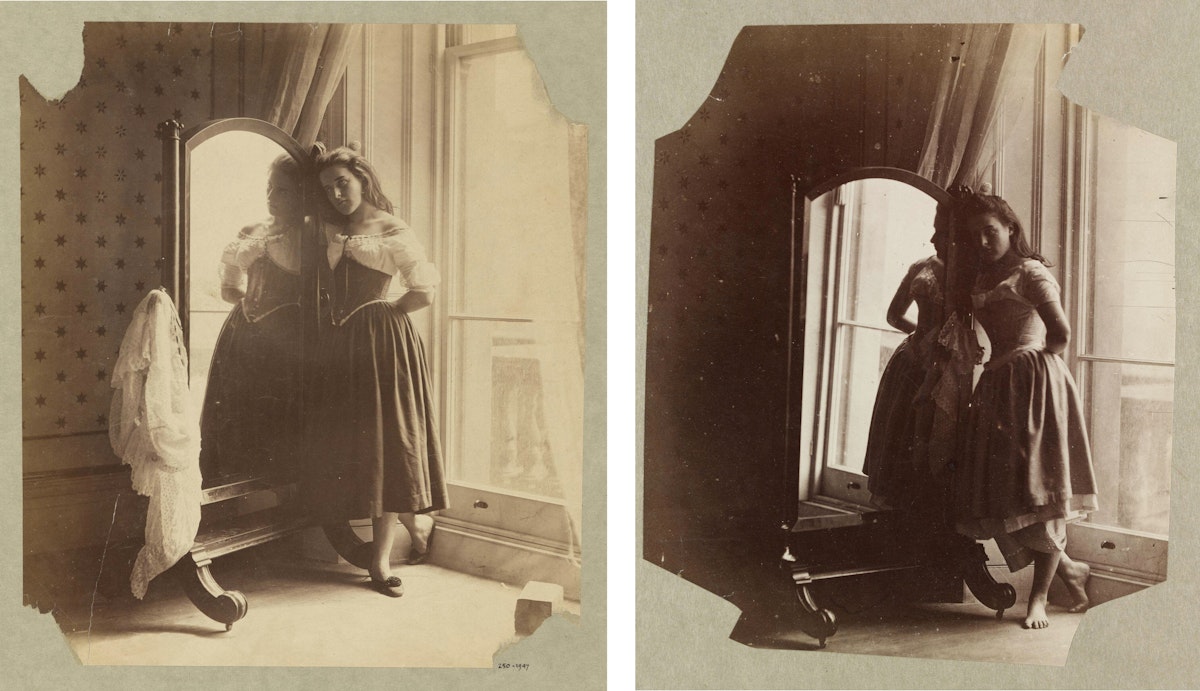 Two sepia-toned photographs side by side of a young woman in a mid-19th century dress, standing beside a full-length mirror and looking towards the camera. The pose in each is essentially similar, but slight differences show different moments. The lighting on the right image is darker, and the woman is not wearing shoes.