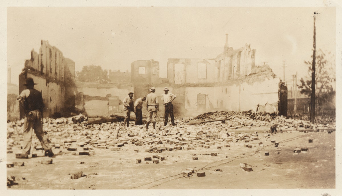 Standing in the ruins of a building