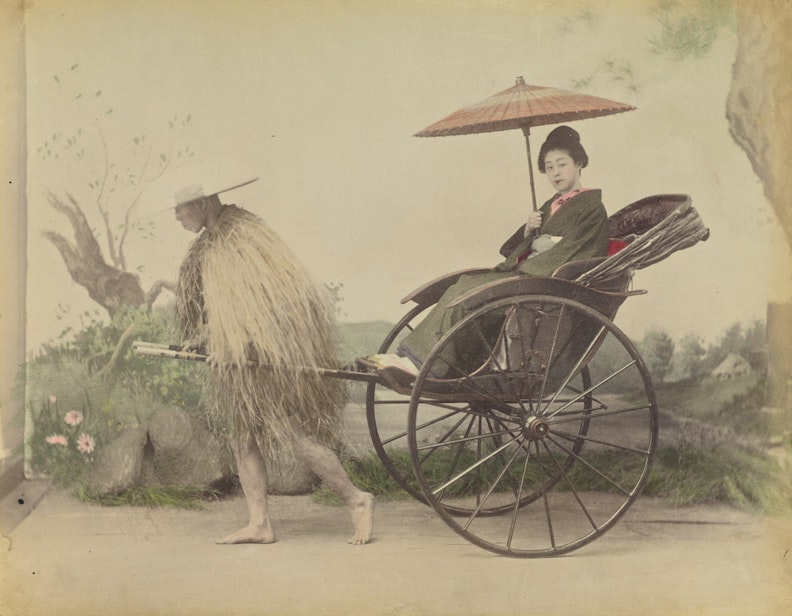 Woman with Parasol being Pulled in a Jinrikisha